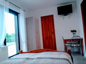 Postel nebo postele na pokoji v ubytování Jarek