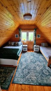 En eller flere senge i et værelse på Zacisze Leśne