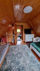 En eller flere senge i et værelse på Zacisze Leśne