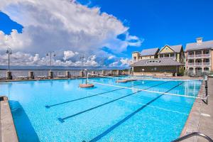 a large swimming pool in front of a hotel at Sunset Island - Beachside Mews 1 & 2 in Ocean City