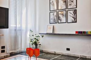 Televízia a/alebo spoločenská miestnosť v ubytovaní Santa Margherita Apartment in the city center