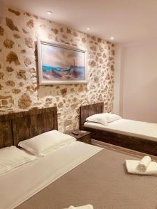 Postel nebo postele na pokoji v ubytování Alex Boutique Hotel
