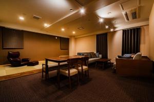 a meeting room with a table and chairs at Randor Residence Susukino Suites in Sapporo