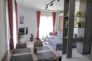 a living room with a couch and a table at Allure Apartments in Ulcinj