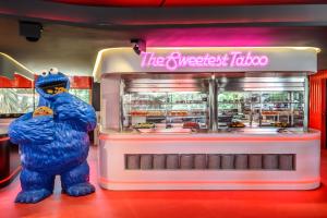 a mascot standing in front of a food truck at Hotel Vibra District - Adults Only in San Antonio