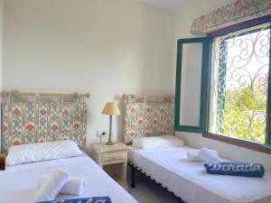 A bed or beds in a room at MILA adosado vistas al mar
