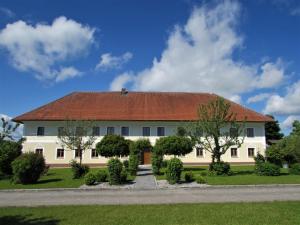 a large white house with a red roof at Hochhubergut in Aschach an der Steyr