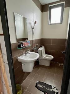 a bathroom with a sink and a toilet at Ánh Vân Villa hotel in Da Lat