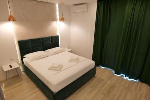 Postel nebo postele na pokoji v ubytování Kuburi Hotel