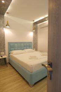 Postel nebo postele na pokoji v ubytování Kuburi Hotel