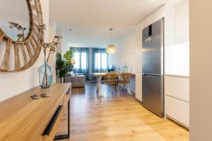 Televízia a/alebo spoločenská miestnosť v ubytovaní Bravissimo Gerió, 2-bedroom apartment