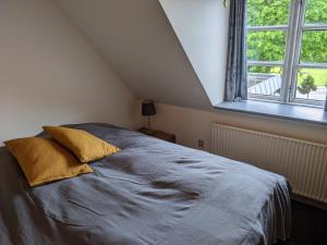 Een bed of bedden in een kamer bij Sevel Kro