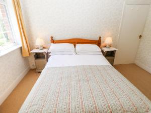 Ένα ή περισσότερα κρεβάτια σε δωμάτιο στο East Farm Cottage