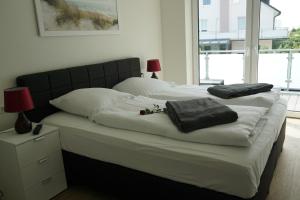 Ένα ή περισσότερα κρεβάτια σε δωμάτιο στο Hohe Geest Whg. 6