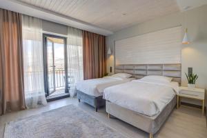 Olimp Hotel客房内的一张或多张床位