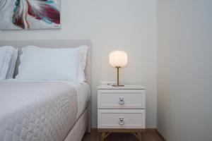 Posteľ alebo postele v izbe v ubytovaní Vincenzo Suites