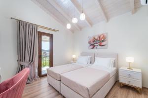 Posteľ alebo postele v izbe v ubytovaní Vincenzo Suites