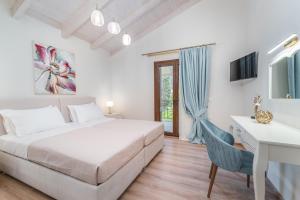 Posteľ alebo postele v izbe v ubytovaní Vincenzo Suites