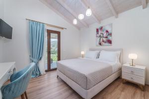 Posteľ alebo postele v izbe v ubytovaní Vincenzo Suites