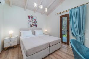 Posteľ alebo postele v izbe v ubytovaní Vincenzo Suites