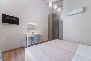 Posteľ alebo postele v izbe v ubytovaní Vincenzo Suites