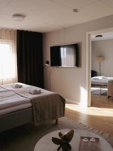 Säng eller sängar i ett rum på Siljansnäs Hotell