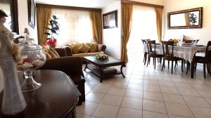 a living room with a couch and a table at Holiday Home in Agios Nikolaos