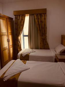 Postel nebo postele na pokoji v ubytování Hamad Saif Batal Hotel