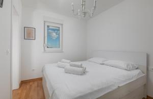 Postel nebo postele na pokoji v ubytování The View Makarska Apartment NH