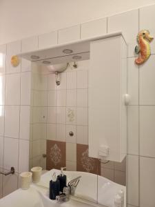 Kúpeľňa v ubytovaní Casa Ilanfra - appartamenti Gabbiano, Farfalla e Stella Marina