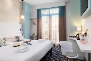 Postel nebo postele na pokoji v ubytování Hôtel Byakko Nice + 37 fotografií