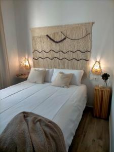 מיטה או מיטות בחדר ב-Ishel Trafalgar