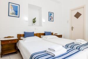 Postel nebo postele na pokoji v ubytování Hotel Dina