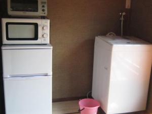 Kuchyň nebo kuchyňský kout v ubytování ビーチハウス沼津Beach house numazu ビーチ至近