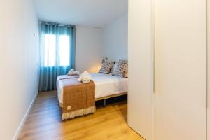 Posteľ alebo postele v izbe v ubytovaní Bravissimo Tarlà, 2-bedroom apartment