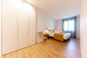 Posteľ alebo postele v izbe v ubytovaní Bravissimo Tarlà, 2-bedroom apartment