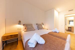 Posteľ alebo postele v izbe v ubytovaní Bravissimo Tarlà, 2-bedroom apartment