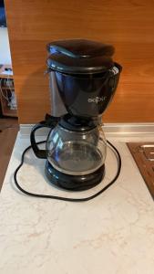 a black coffee pot sitting on top of a counter at Flora Ski-slope Studio Apartment in Borovets