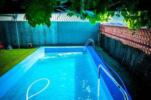 a swimming pool with blue water in a backyard at 3 bedrooms villa with private pool furnished terrace and wifi at Vitigudino in Vitigudino