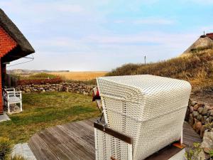 a white refrigerator sitting on top of a wooden deck at Uep Soel in Kampen