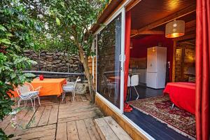 a patio with a table and chairs on a house at Finca OASIS Fataga in Maspalomas