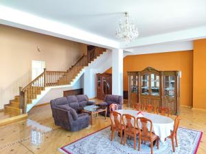 a living room with a table and chairs at GUEST HOUSE "Rohat Lux" in Samarkand