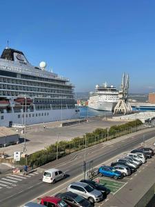 a cruise ship is docked next to a parking lot at Apartments Nina in Koper