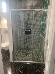 a shower stall in a bathroom with a toilet at Villa Tenjin Chambre 8 in Bondy +22 photos