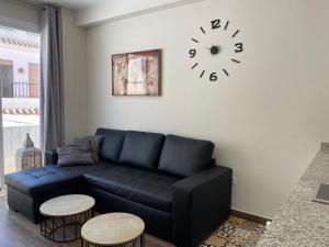 Ein Sitzbereich in der Unterkunft Apartamentos San Miguel