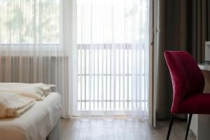 Posteľ alebo postele v izbe v ubytovaní Seehotel Vinzenz