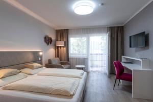 Posteľ alebo postele v izbe v ubytovaní Seehotel Vinzenz
