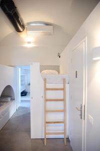 A bunk bed or bunk beds in a room at Central Hostel Oia