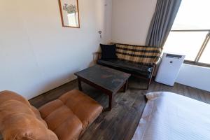 Area soggiorno di Ichi The Hostel