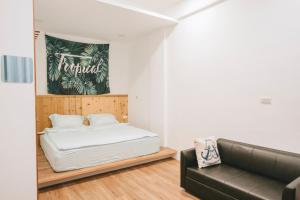 Postel nebo postele na pokoji v ubytování Wind Wave Ocean Homestay